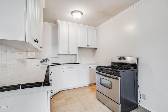 8730 Marshall St, Rosemead, CA 91770 - kitchen with gas stove, tile counters, white cabinetry, tasteful backsplash, and crown molding
