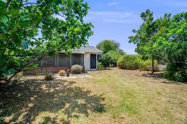 8730 Marshall St, Rosemead, CA 91770 - view of grassy yard featuring a sunroom