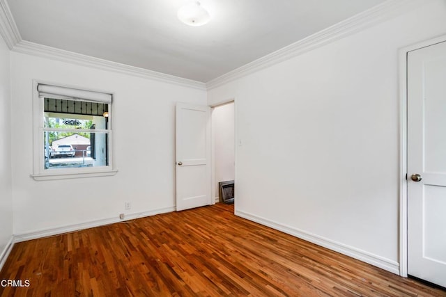 8730 Marshall St, Rosemead, CA 91770 - empty room featuring crown molding, wood finished floors, and baseboards