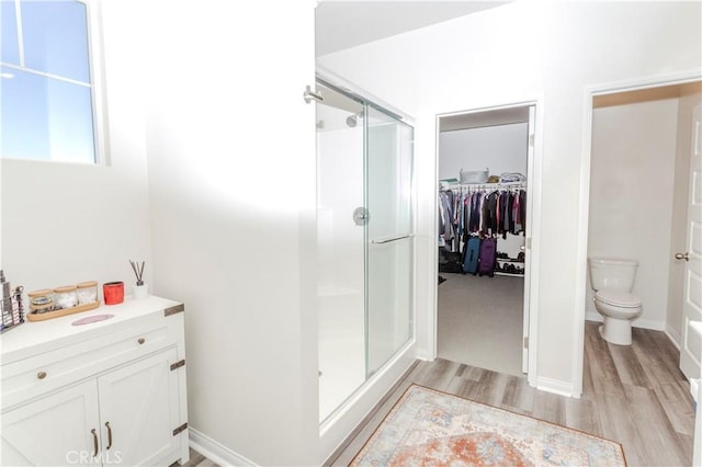 28252 Farm Creek Way, Valley Center, CA 92082 - full bathroom with a stall shower, wood finished floors, and a walk in closet