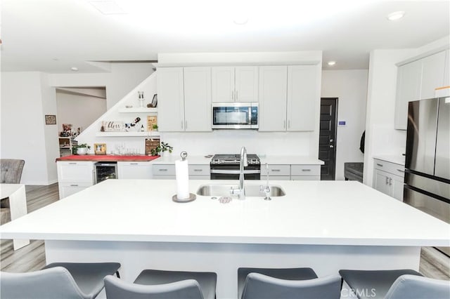 28252 Farm Creek Way, Valley Center, CA 92082 - kitchen featuring appliances with stainless steel finishes, a breakfast bar, light countertops, and recessed lighting