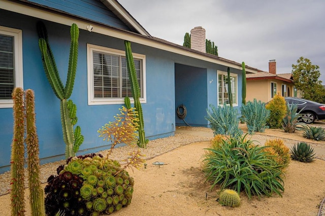 2219 Montemar, Escondido, CA 92027 - doorway to property featuring a chimney and stucco siding