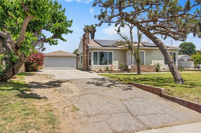 5342 Kingsley St, Montclair, CA 91763 - ranch-style home with stucco siding, a front yard, a chimney, solar panels, and a garage