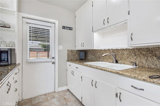 5342 Kingsley St, Montclair, CA 91763 - kitchen featuring tasteful backsplash, white cabinets, and open shelves