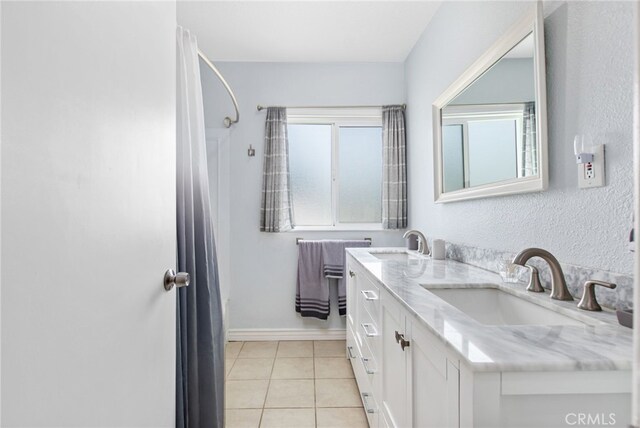 5342 Kingsley St, Montclair, CA 91763 - full bath featuring double vanity and tile patterned floors