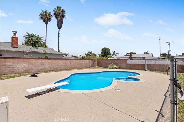 5342 Kingsley St, Montclair, CA 91763 - view of pool with a patio area, a fenced backyard, a diving board, and a pool with connected hot tub