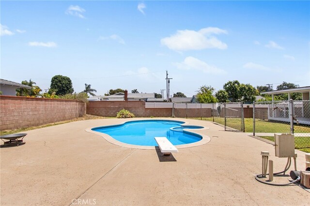 5342 Kingsley St, Montclair, CA 91763 - view of swimming pool with a fenced backyard, a diving board, and a patio area
