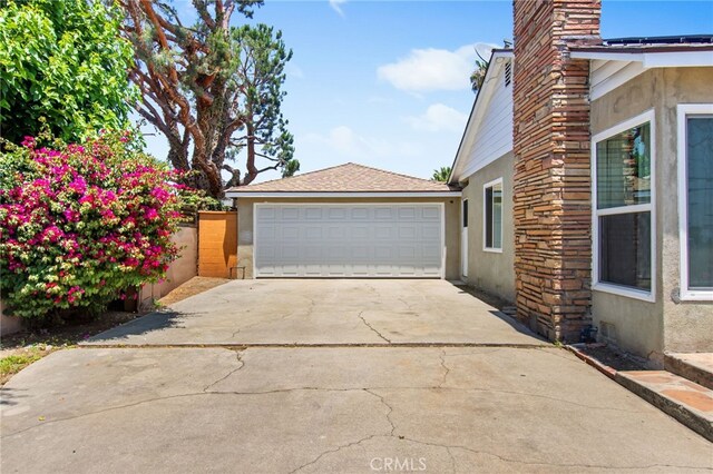 5342 Kingsley St, Montclair, CA 91763 - view of home's exterior with stucco siding, a chimney, and concrete driveway