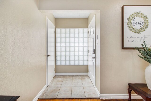 5342 Kingsley St, Montclair, CA 91763 - corridor featuring light tile patterned floors and baseboards