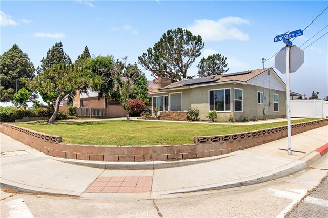 5342 Kingsley St, Montclair, CA 91763 - view of front facade with solar panels and stucco siding