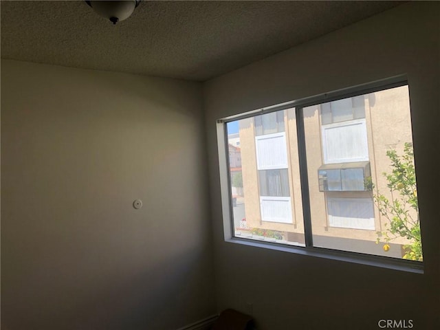 218 N Nicholson Ave, Monterey Park, CA 91755 - unfurnished room featuring a textured ceiling