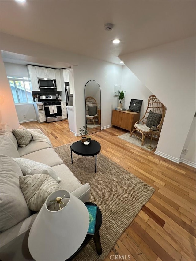 4113 E 10th St Unit 2, Long Beach, CA 90804 - living area featuring baseboards, light wood-style floors, and recessed lighting