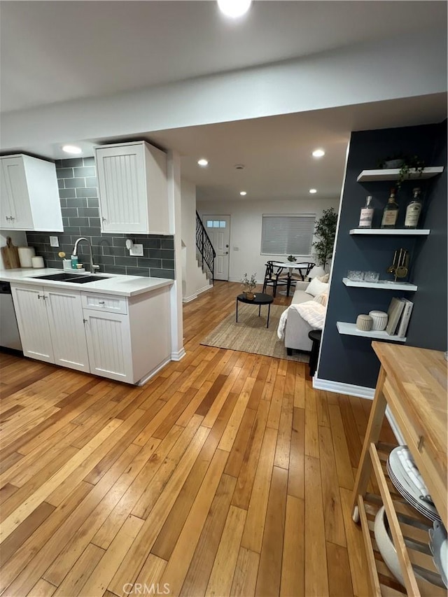 4113 E 10th St Unit 2, Long Beach, CA 90804 - kitchen with a sink, light countertops, white cabinets, decorative backsplash, and recessed lighting