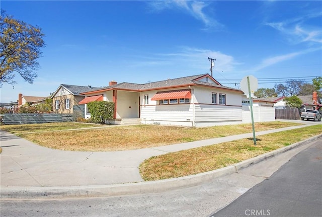 1401 N Linwood Ave, Santa Ana, CA 92701 - view of front of property with a garage and a chimney