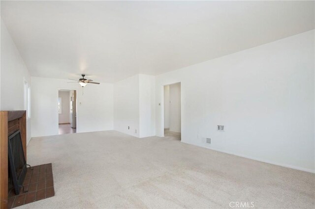 1401 N Linwood Ave, Santa Ana, CA 92701 - unfurnished living room with carpet flooring and a ceiling fan