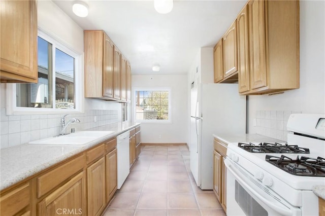 1401 N Linwood Ave, Santa Ana, CA 92701 - kitchen with white appliances, a sink, tasteful backsplash, light brown cabinetry, and light tile patterned floors
