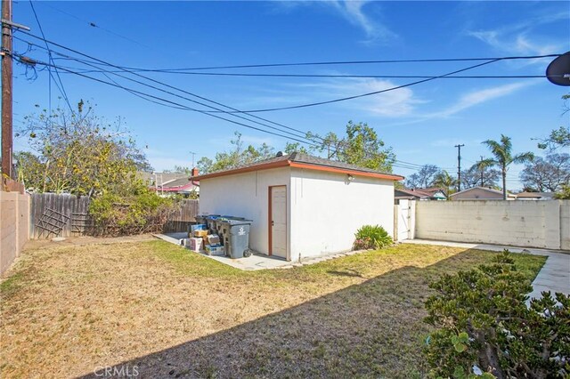 1401 N Linwood Ave, Santa Ana, CA 92701 - back of house featuring stucco siding and an outdoor structure