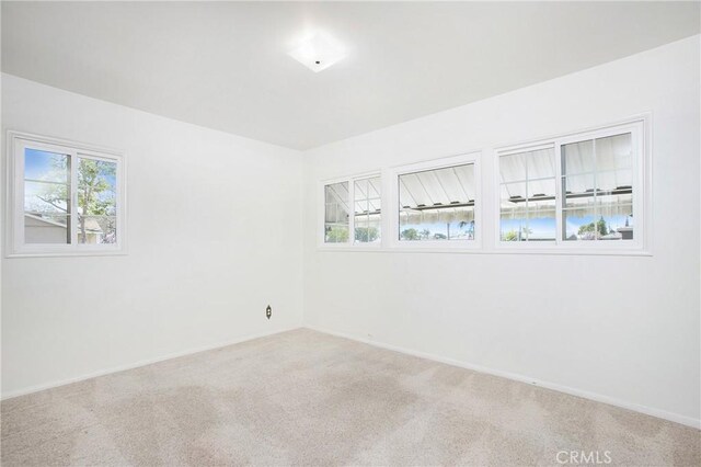 1401 N Linwood Ave, Santa Ana, CA 92701 - carpeted empty room with baseboards