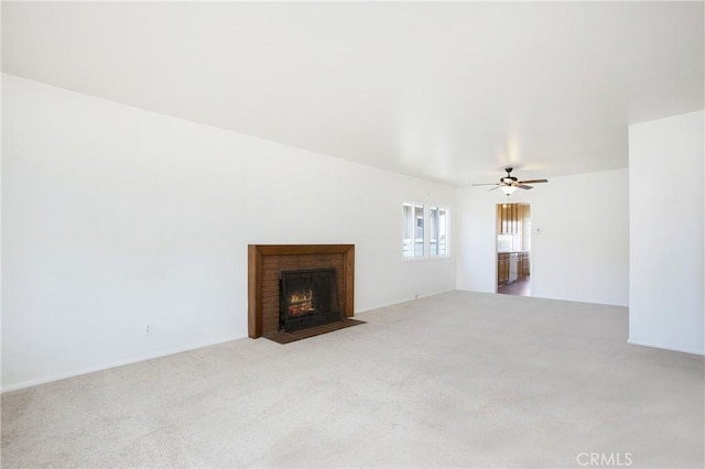 1401 N Linwood Ave, Santa Ana, CA 92701 - unfurnished living room with carpet floors, a brick fireplace, and a ceiling fan