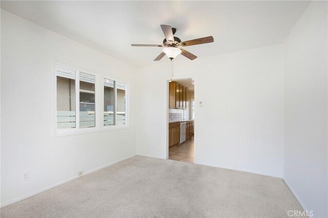 1401 N Linwood Ave, Santa Ana, CA 92701 - spare room featuring ceiling fan, light carpet, and baseboards
