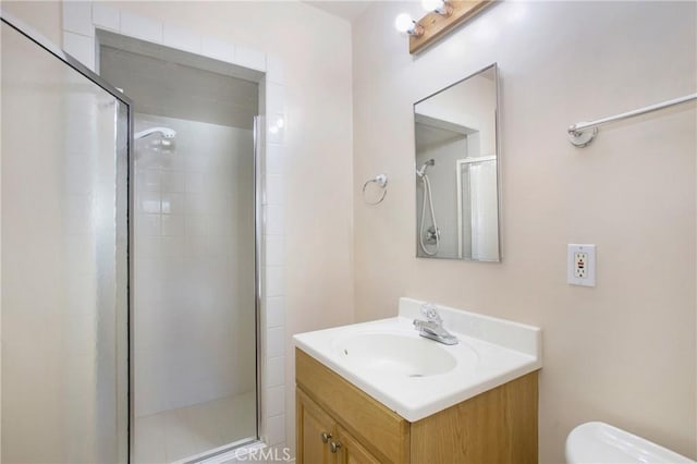 1401 N Linwood Ave, Santa Ana, CA 92701 - bathroom featuring vanity, a stall shower, and toilet