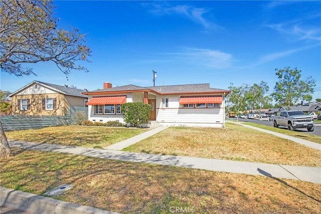 1401 N Linwood Ave, Santa Ana, CA 92701 - ranch-style home with a chimney and a front yard