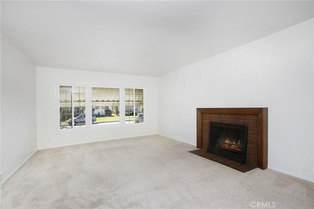1401 N Linwood Ave, Santa Ana, CA 92701 - unfurnished living room with carpet flooring and a fireplace