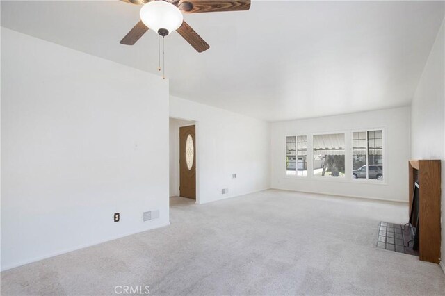 1401 N Linwood Ave, Santa Ana, CA 92701 - unfurnished living room with carpet floors and a ceiling fan