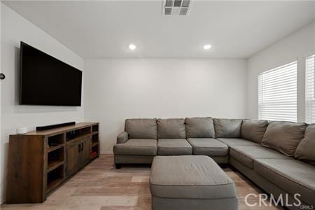 7155 Citrus Ave Unit 320, Fontana, CA 92336 - living room featuring light wood-style floors and recessed lighting