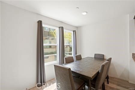7155 Citrus Ave Unit 320, Fontana, CA 92336 - dining space featuring light wood-type flooring