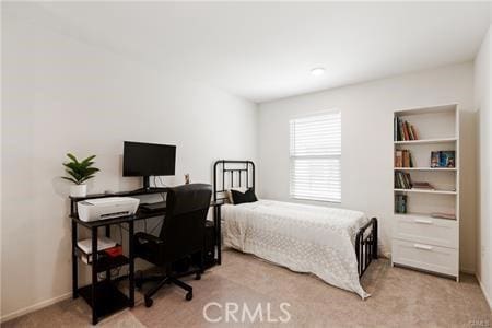 7155 Citrus Ave Unit 320, Fontana, CA 92336 - bedroom featuring light carpet and a desk