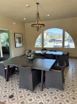 7155 Citrus Ave Unit 320, Fontana, CA 92336 - dining area featuring a chandelier, recessed lighting, and light tile patterned flooring