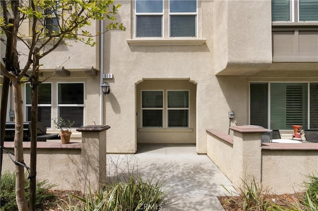 7155 Citrus Ave Unit 320, Fontana, CA 92336 - property entrance with stucco siding