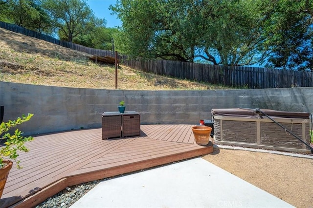 7560 Castano Ave, Atascadero, CA 93422 - wooden terrace featuring a hot tub, a fenced backyard, and a patio area