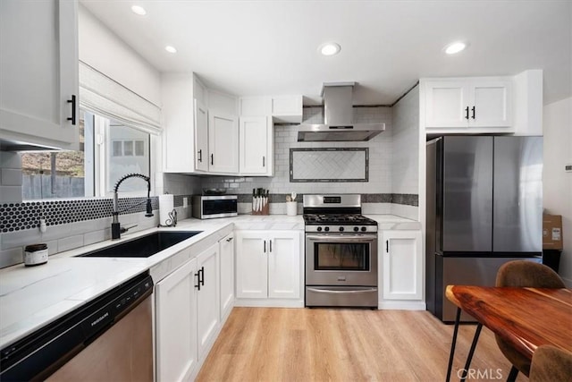 7560 Castano Ave, Atascadero, CA 93422 - kitchen featuring stainless steel appliances, wall chimney exhaust hood, backsplash, light countertops, and recessed lighting