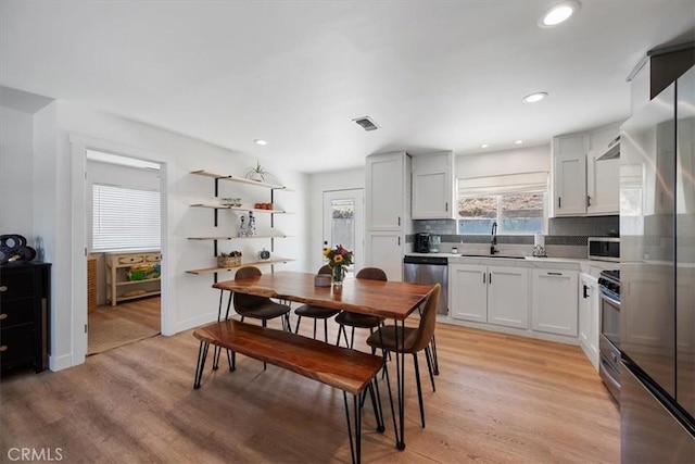 7560 Castano Ave, Atascadero, CA 93422 - dining area featuring light wood-style floors and recessed lighting