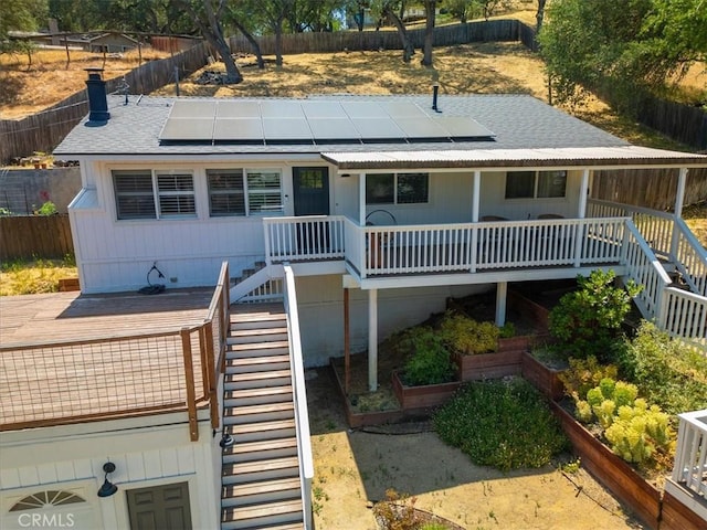 7560 Castano Ave, Atascadero, CA 93422 - view of front of property with stairway, roof mounted solar panels, and a shingled roof