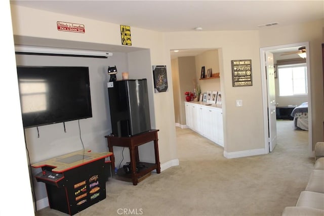 45344 Saint Tisbury St, Temecula, CA 92592 - living room with light carpet, ceiling fan, and baseboards