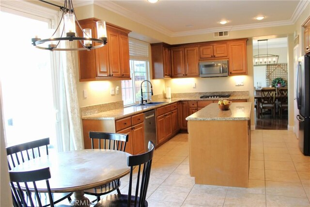 45344 Saint Tisbury St, Temecula, CA 92592 - kitchen featuring appliances with stainless steel finishes, a chandelier, a sink, a center island, and ornamental molding