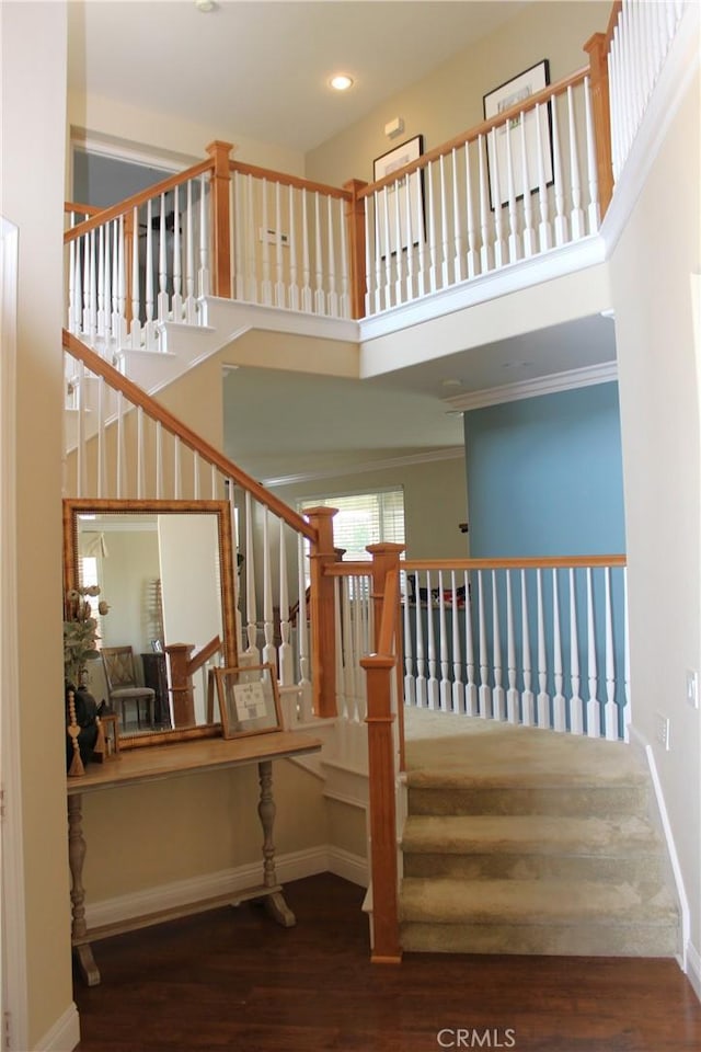 45344 Saint Tisbury St, Temecula, CA 92592 - stairs featuring a high ceiling, wood finished floors, recessed lighting, baseboards, and ornamental molding
