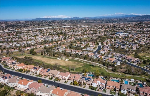 45344 Saint Tisbury St, Temecula, CA 92592 - aerial overview of property's location featuring a mountainous background, nearby suburban area, and a golf course