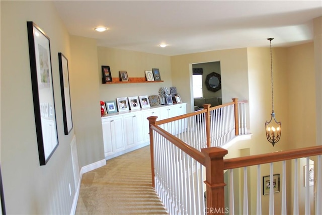 45344 Saint Tisbury St, Temecula, CA 92592 - hallway featuring a chandelier, an upstairs landing, light colored carpet, and recessed lighting