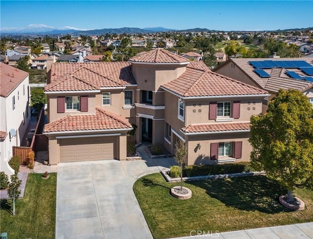 45344 Saint Tisbury St, Temecula, CA 92592 - mediterranean / spanish-style house with concrete driveway, a tiled roof, stucco siding, and a residential view