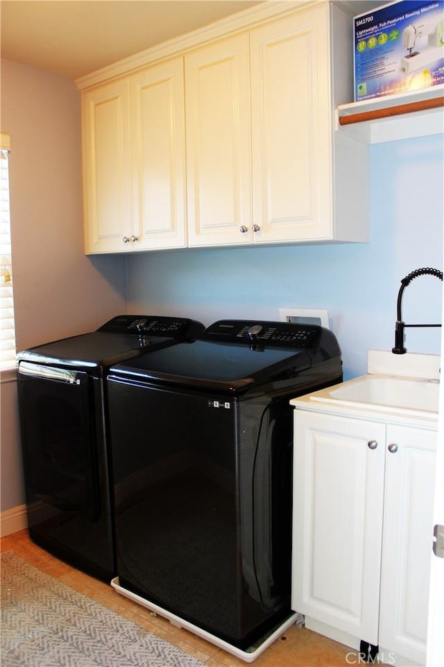 45344 Saint Tisbury St, Temecula, CA 92592 - laundry area featuring washer and dryer and cabinet space