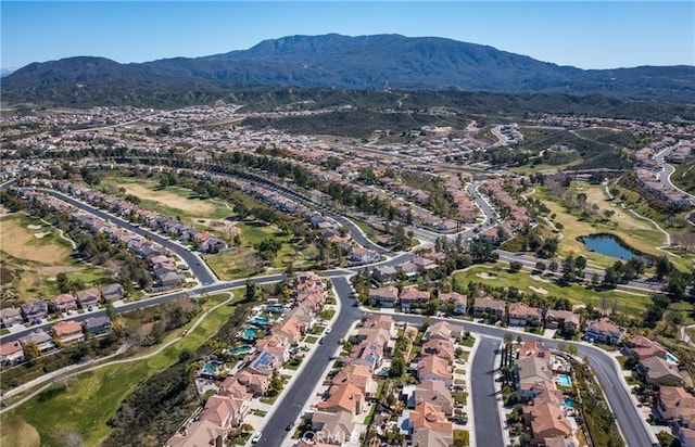 45344 Saint Tisbury St, Temecula, CA 92592 - aerial view of property and surrounding area featuring nearby suburban area, a local golf course, and a water and mountain view