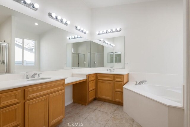 1583 Turtle Crk, Beaumont, CA 92223 - bathroom with double vanity, a shower stall, a garden tub, and tile patterned floors