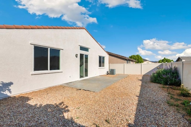1583 Turtle Crk, Beaumont, CA 92223 - back of house with a fenced backyard, a patio area, and stucco siding