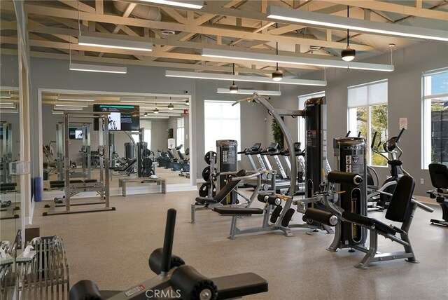 1583 Turtle Crk, Beaumont, CA 92223 - gym with healthy amount of natural light, beam ceiling, and high vaulted ceiling