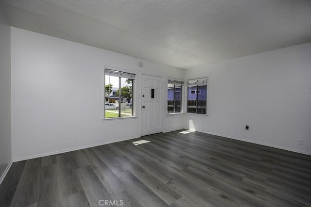 2292 Euclid Ave, Long Beach, CA 90815 - spare room featuring dark wood-style flooring, baseboards, and a textured ceiling