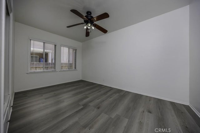 2292 Euclid Ave, Long Beach, CA 90815 - empty room with dark wood-style floors, a ceiling fan, and baseboards